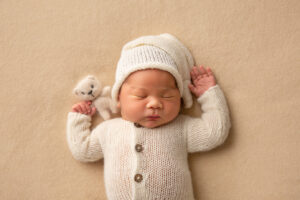 Newborn baby sleeping during photo session in Wishart