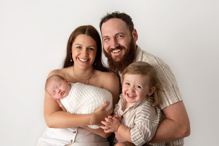 Tiny newborn hands held by parent - Brisbane newborn photography