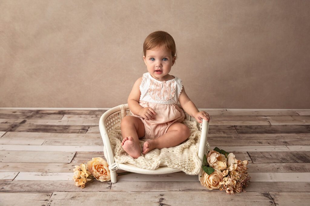 Brisbane Sitter Milestone photographer - girl sitting with flowers